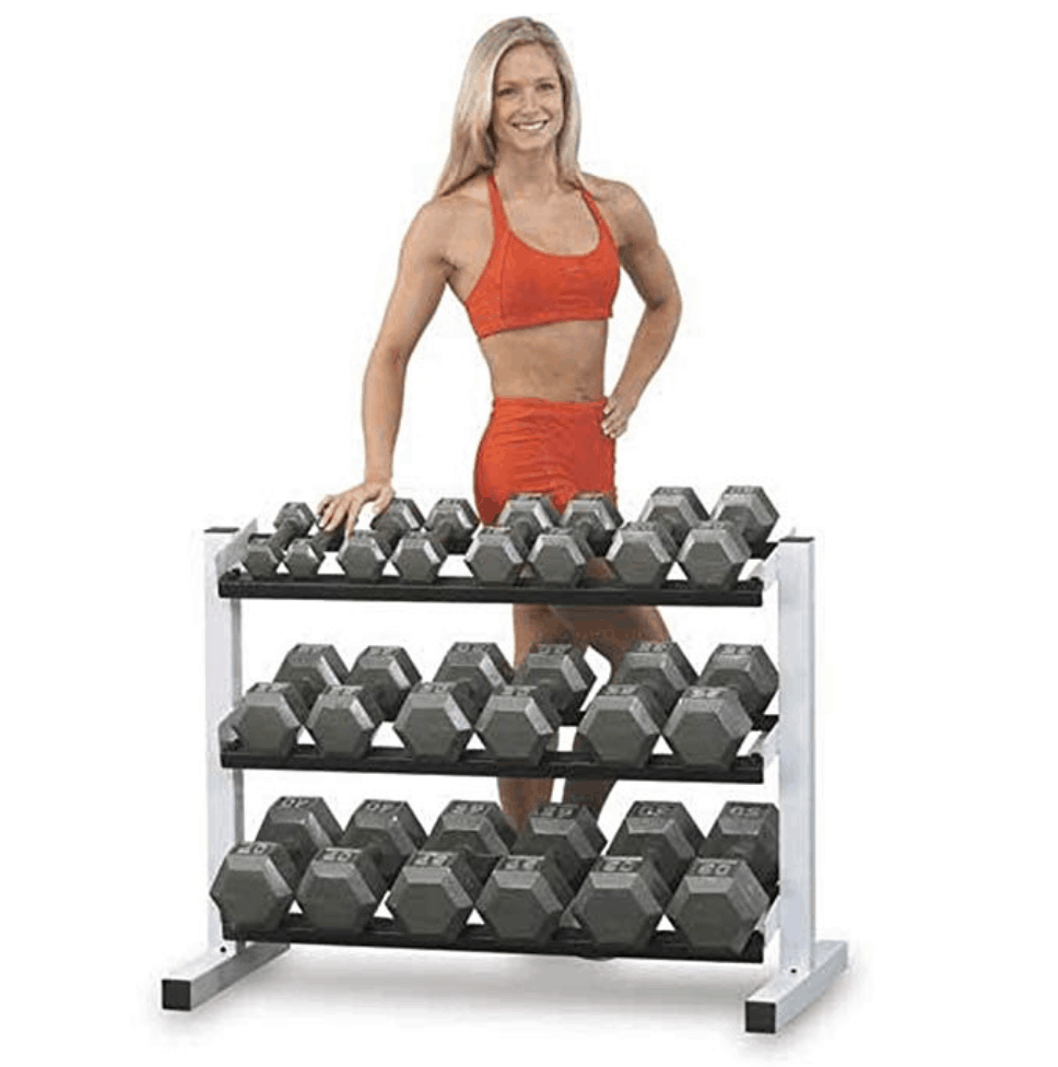 lady standing behind free weights on a rack for home gym 