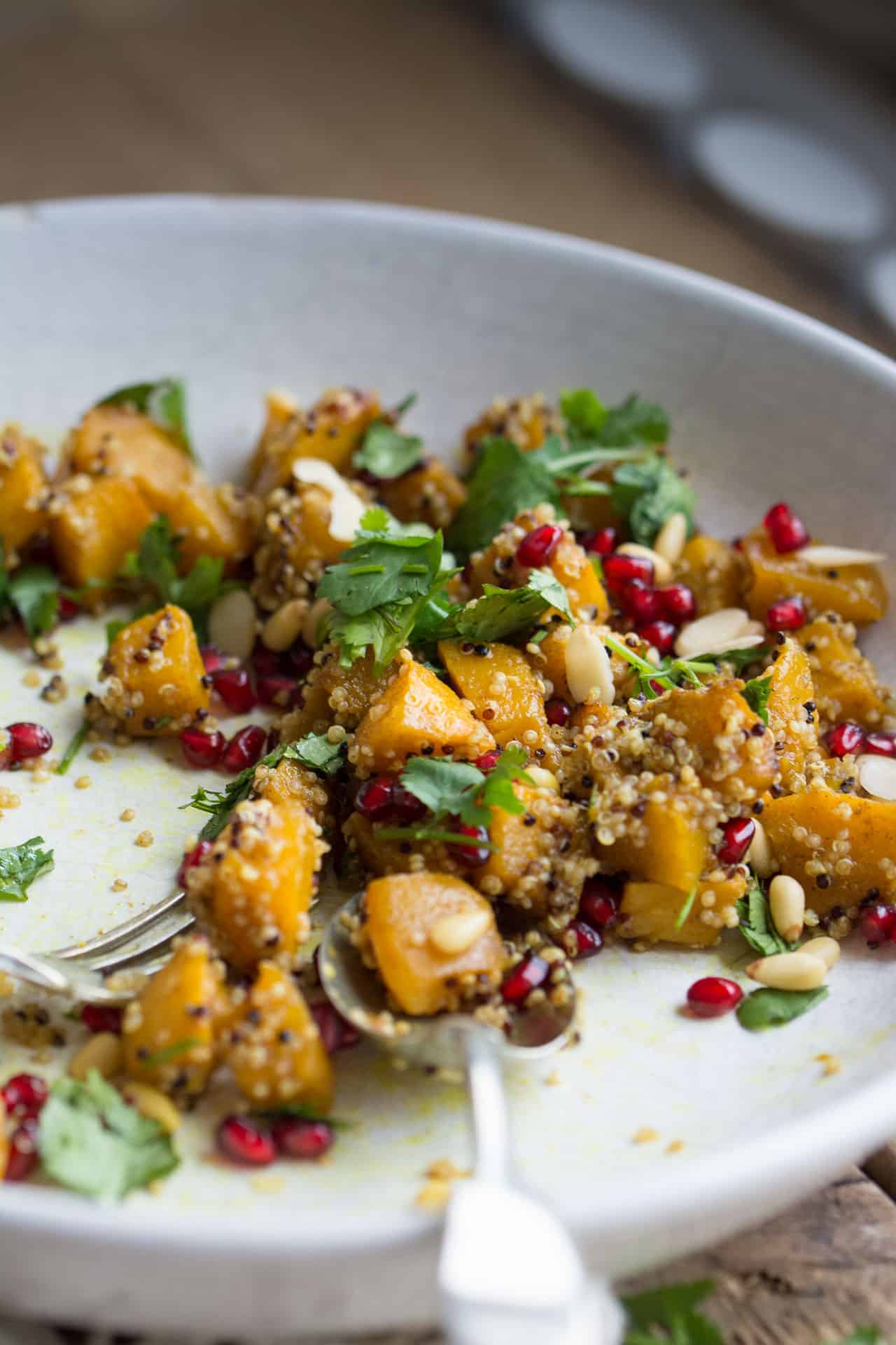 Autumn salad with pumpkin, quinoa and pomegranate in a bowl