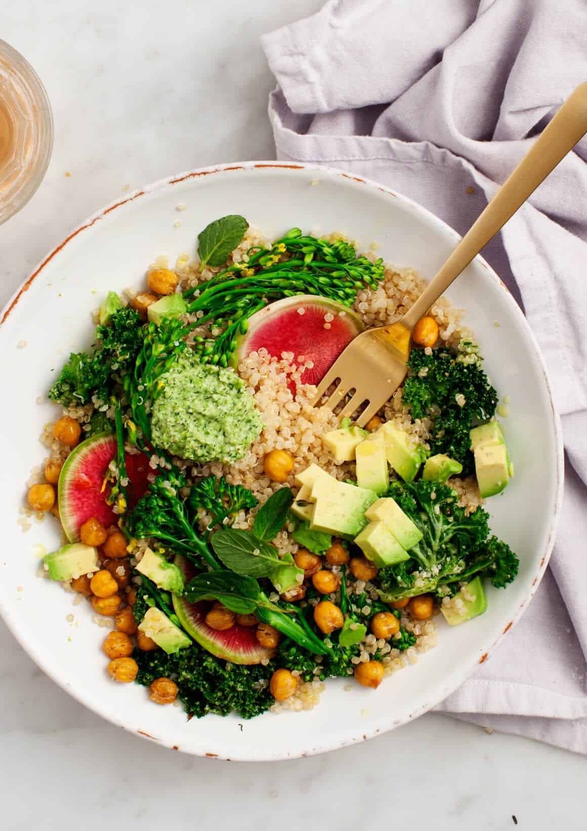 broccoli with pesto quinoa salad in a bowl