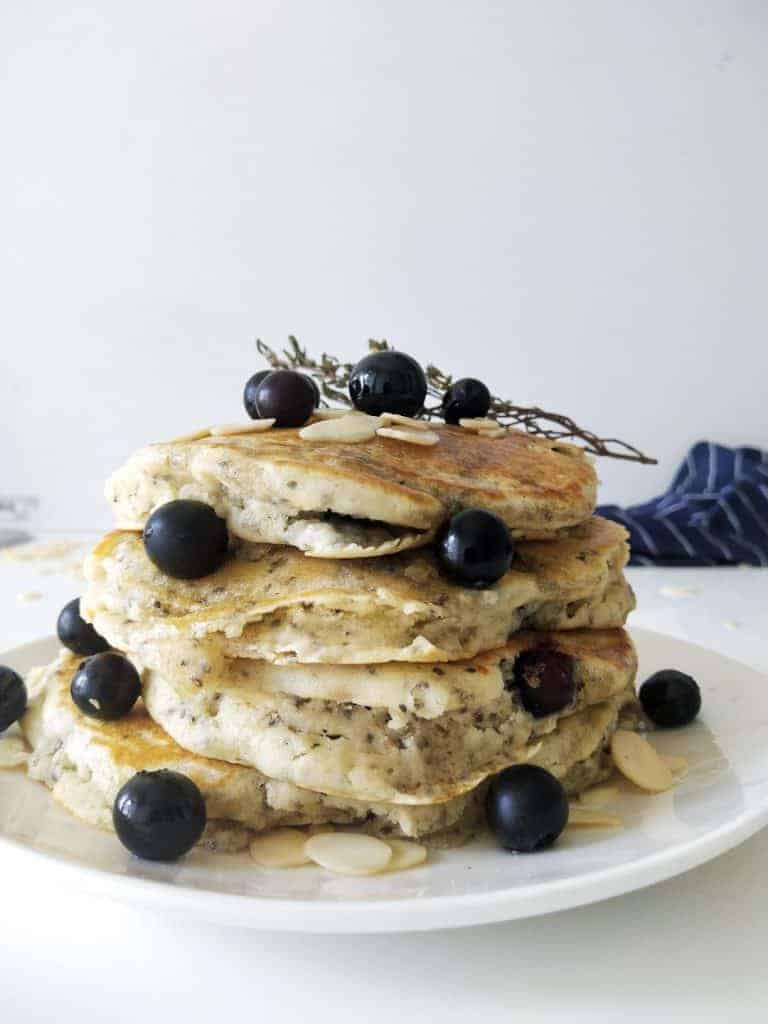 plate of fluffy chia pancakes with blueberries and almonds